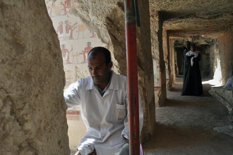 Egyptian archaeologists work inside the new  tomb of Shedsu Djehuty in Luxor, 700km south of Cairo, Egypt. EPA