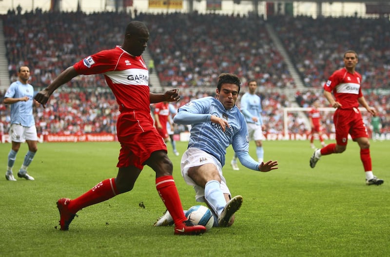 MIDDLESBROUGH, UNITED KINGDOM - MAY 11:  Javier Garrido of Manchester City tackles George Boateng of Middlesbrough during the Barclays Premier League Match between Middlesbrough and Manchester City at Riverside Stadium on May 11, 2008 in Middlesbrough, England.  (Photo by Warren Little/Getty Images)