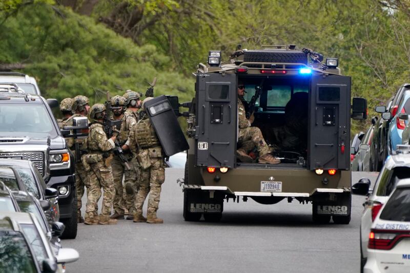 Police respond near the scene of the shooting. AP