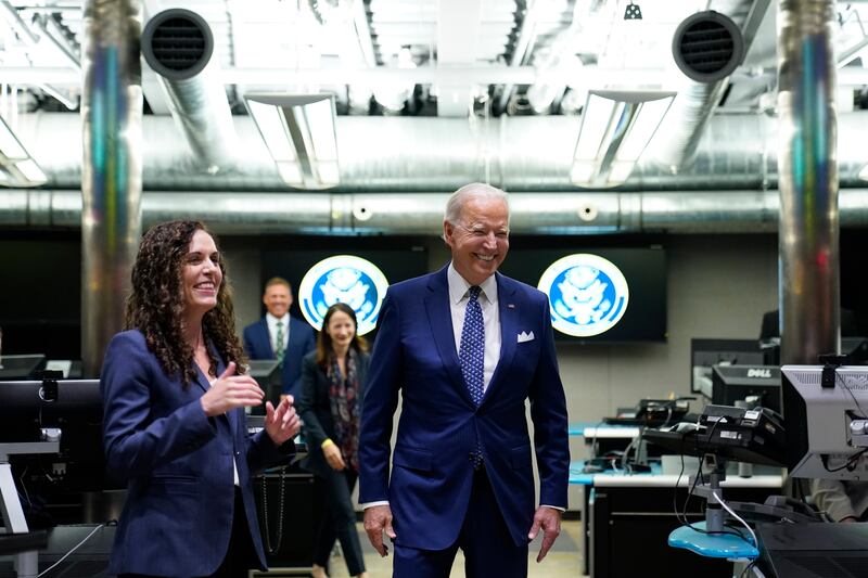 President Joe Biden talks with Christine Abizaid, director of the National Counter-terrorism Centre, during a visit to McLean, Virginia. AP