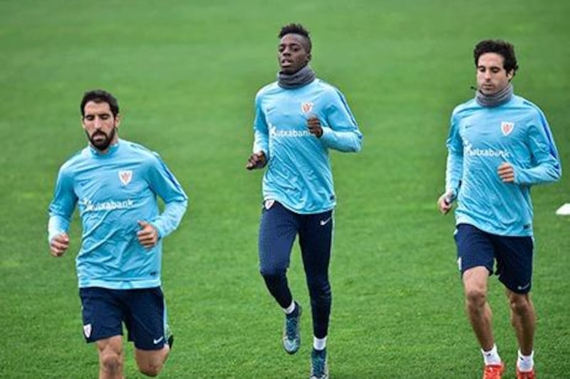 Inaki Williams, centre, may look out of place at Athletic Bilbao – because of his roots – but the Liberian-born player feels right at home. Alvaro Barrientos / AP Photo