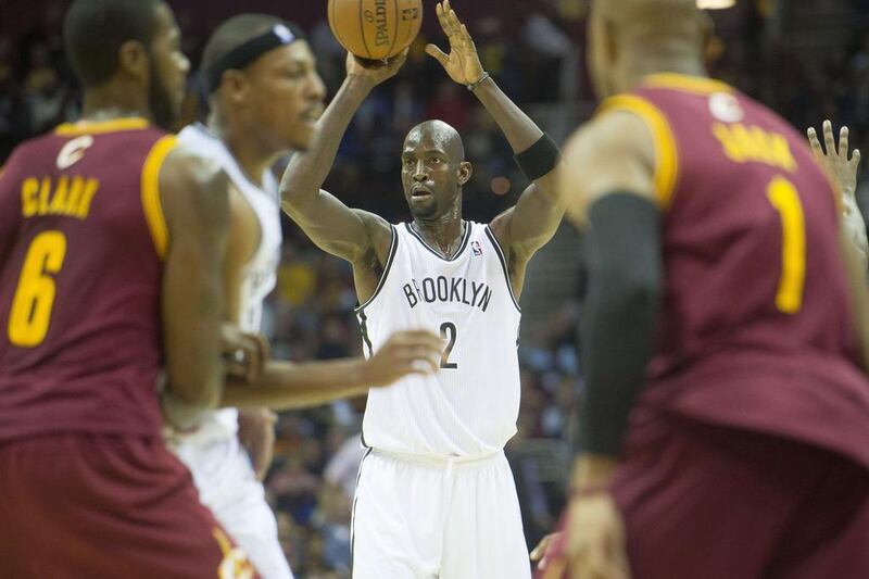 Kevin Garnett is part of the veteran movement initiated at the Brooklyn Nets by owner Mikhail Prokhorov to deliver an NBA title as soon as possible. Jason Miller / AFP