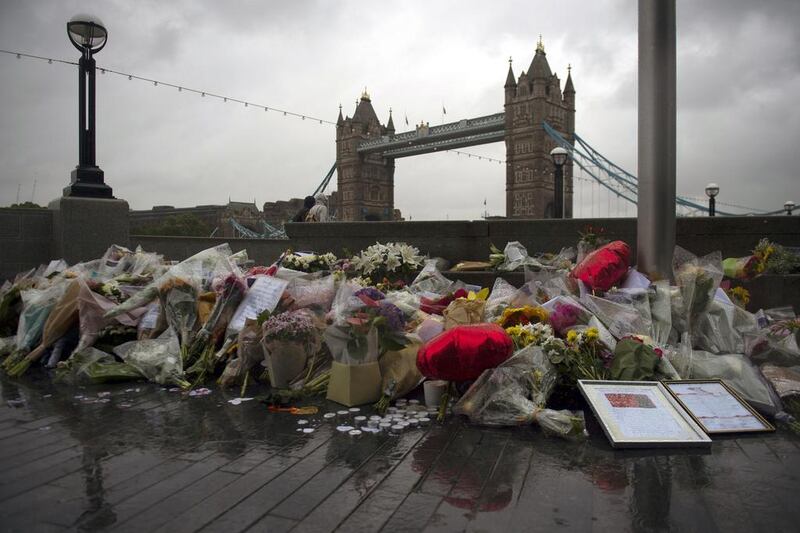 Flowers and tributes left outside City Hall, near Tower Bridge for victims of the London Bridge terror attacks in Central London. EPA/WILL OLIVER