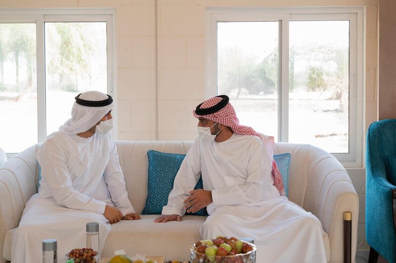 AJMAN, UNITED ARAB EMIRATES - May 14, 2021: HH Sheikh Hamdan bin Mohamed bin Zayed Al Nahyan (L), exchanges Eid greetings with HH Sheikh Ammar bin Humaid Al Nuaimi, Crown Prince of Ajman (R).

( Mohamed Al Hammadi / Ministry of Presidential Affairs )​
---