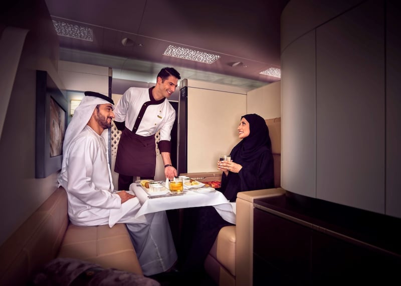 An Etihad cabin crew member serves customers in first class. The Abu Dhabi airline is scaling up operations on the back of a recovery in travel demand.