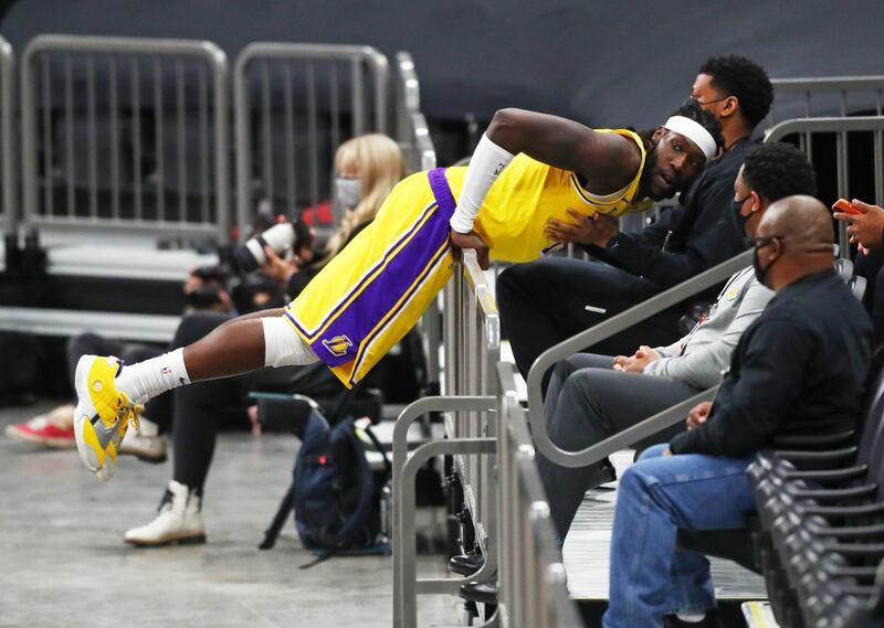 Los Angeles Lakers forward Montrezl Harrell runs out of bounds into a metal railing. Reuters