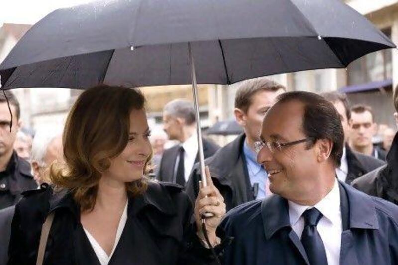 French President Francois Hollande smiles at his partner, Valerie Trierweiler.