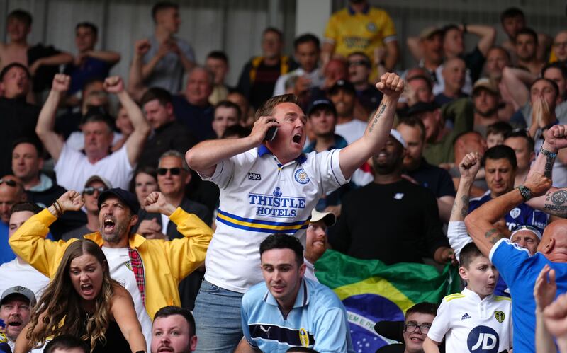 Leeds United fans celebrate during the match. PA