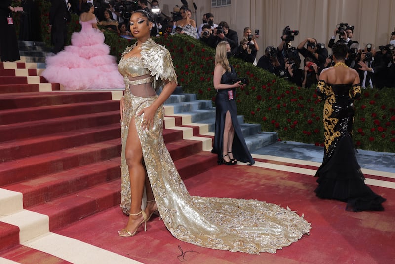 Rapper Megan Thee Stallion wearing golden Moschino. Reuters 