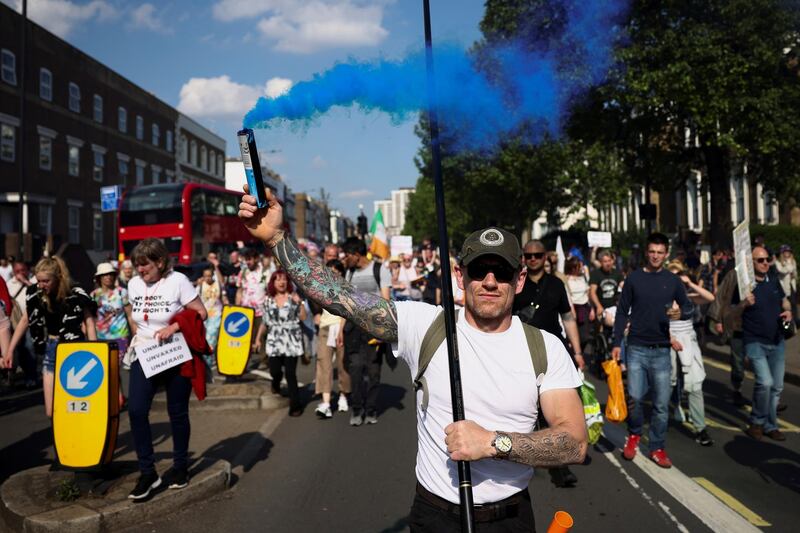 Demonstrators attend an anti-lockdown protest  in London. Reuters