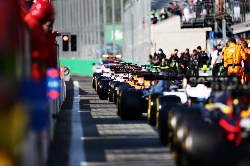 Cars line up in the pitlane before the restart during the Italian GP. Getty