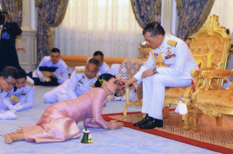 Thai television shows Queen Suthida prostrating herself before the king.