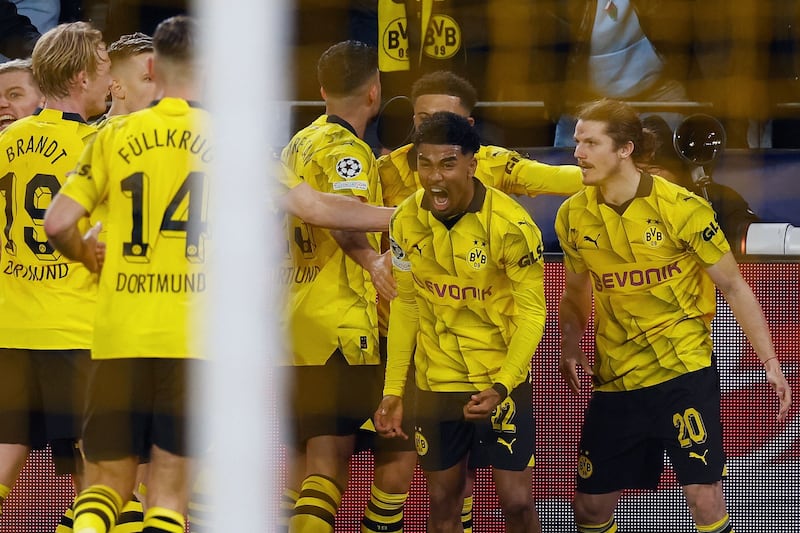 Ian Maatsen celebrates scoring Dortmund's second goal with his teammates. AFP