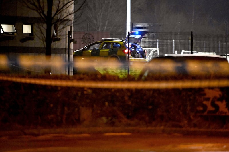 Police Service of Northern Ireland officers work at the scene of the shooting. AP