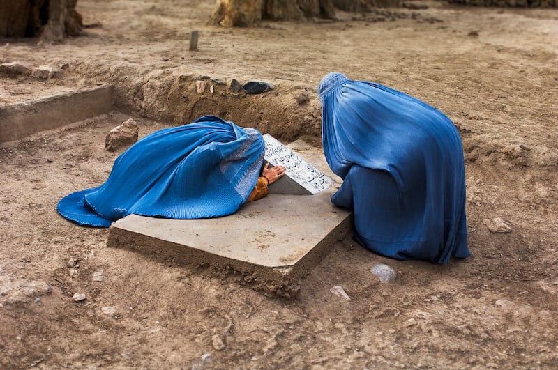 'Two Women Mourn in Cemetery. Bamiyan, Afghanistan, 2007'.