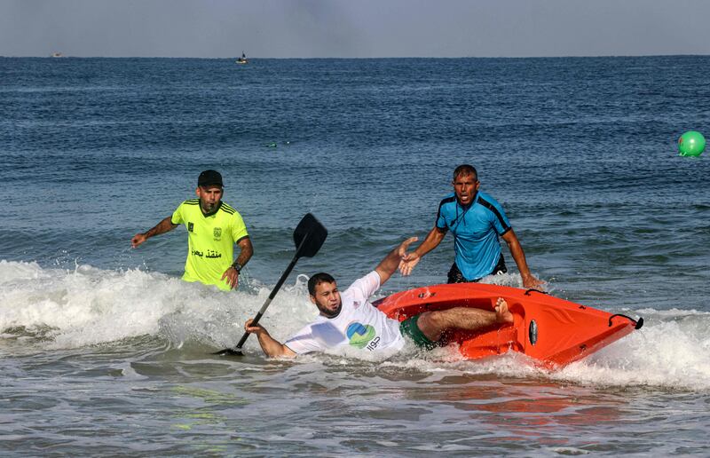 Palestinians take part in a local canoeing championship off the coast of Gaza city.