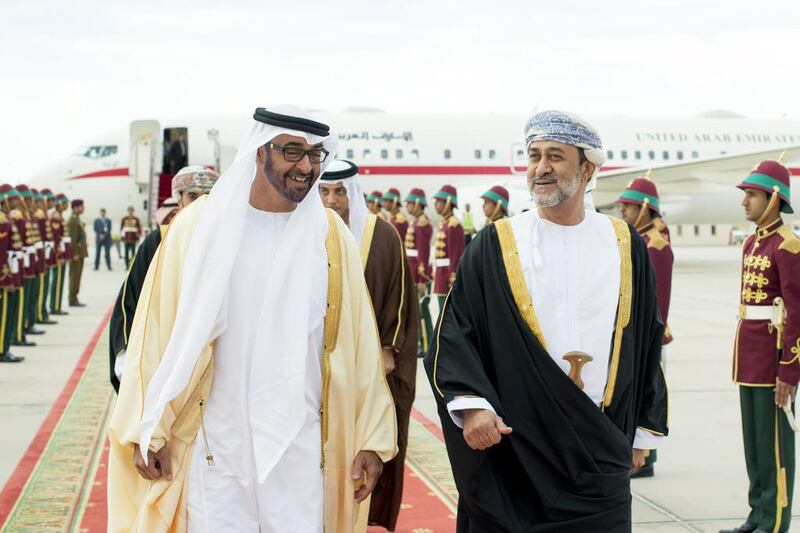 Sheikh Mohammed bin Zayed is received by Oman's Minister of Heritage and Culture, Sayyid Haitham bin Tariq Al Said, right, upon arriving in Muscat for an official visit. Ryan Carter / Crown Prince Court — Abu Dhabi 