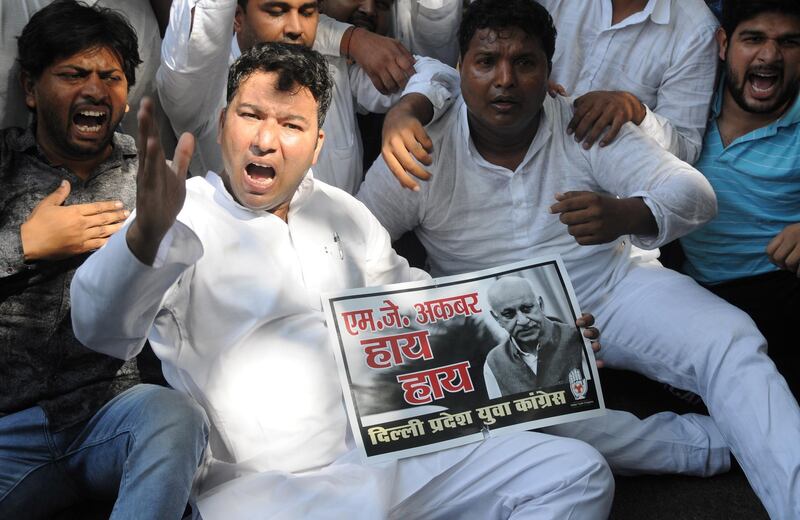 epa07094674 Congress party workers shout slogans as they protest against minister of state for external affairs M.J. Akbar for his alleged sexual misconduct and harassment of journalists, during a protest in New Delhi, India, 15 October 2018. M.J. Akbar has filed a private criminal defamation complaint against journalist Priya Ramani who was first of some dozen women recently who levelled charges of sexual misconduct against him when he was a journalist and editor.  EPA/STR