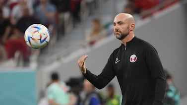 Qatar's Spanish coach Felix Sanchez returns the ball during the Qatar 2022 World Cup Group A football match between Qatar and Senegal at the Al-Thumama Stadium in Doha on November 25, 2022.  (Photo by KARIM JAAFAR  /  AFP)