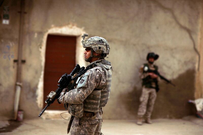 Mandatory Credit: Photo by Maya Alleruzzo/AP/Shutterstock (7049094a)
An Iraqi Army soldier and a U.S. Army soldiers from Delta Co., 1st Combined Arms Battalion, 67th Armor Regiment stand guard during a joint patrol in Mosul, 360 kilometers (225 miles) northwest of Baghdad, Iraq. Two U.S. soldiers were killed, by an Iraqi trooper who opened fire on them during a training exercise Saturday, raising fresh concerns about Iraq's security forces as the Americans prepare to withdraw from the country by the end of this year. Another soldier was killed Saturday during a military operation in central Iraq, making it one of the deadliest days for U.S. forces in the country in months
Iraq US Troops, MOSUL, Iraq