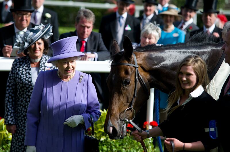 Queen Elizabeth II with her horse Estimate after winning the Queen's Vase during Royal Ascot in 2012. Getty