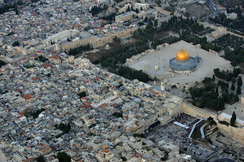 JERUSALEM, ISRAEL - OCTOBER 20: The golden Dome of the Rock Islamic shrine dominates the Temple Mount on which it stands, and below it the Western Wall, Judaism's holiest shrine October 20, 2005 in this aerial view of Jerusalem's Old City. The picture, taken facing north-east, also shows the Muslim Quarter of the Old City, at left. (Photo by David Silverman/Getty Images)