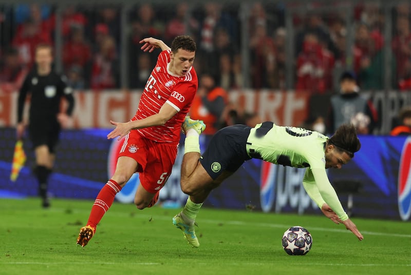 Manchester City's Jack Grealish tangles with Bayern Munich's Benjamin Pavard. Reuters