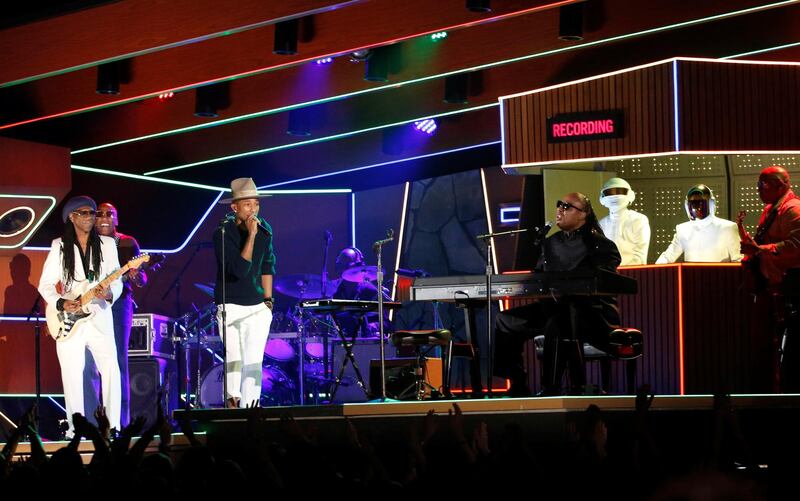Stevie Wonder (R) performs 'Get Lucky' with Pharrell Williams, Nile Rodgers (L)and Daft Punk at the 56th annual Grammy Awards in Los Angeles, California, in 2014. Reuters