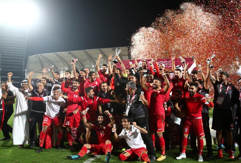 Soccer Football - Gulf Cup - Final - Bahrain v Saudi Arabia - Abdullah bin Khalifa Stadium, Doha, Qatar - December 8, 2019  Bahrain players and coaching staff celebrate winning the Gulf Cup after the match  REUTERS/Ibraheem Al Omari