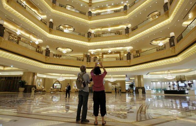 Tourists at the Emirates Palace Hotel in Abu Dhabi, dressed in a manner approved by the British Foreign Office.