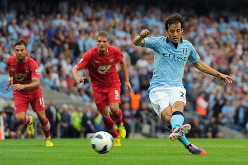 MANCHESTER, ENGLAND - AUGUST 19:  David Silva of Manchester City takes and misses a penalty kick  during the Barclays Premier League match between Manchester City and Southampton at Etihad Stadium on August 19, 2012 in Manchester, England.  (Photo by Michael Regan/Getty Images)