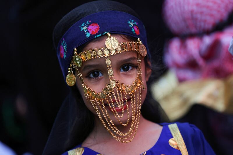 A Saudi girl wearing traditional clothes celebrates Saudi Arabia's Founding Day at The Boulevard in Riyadh. Reuters