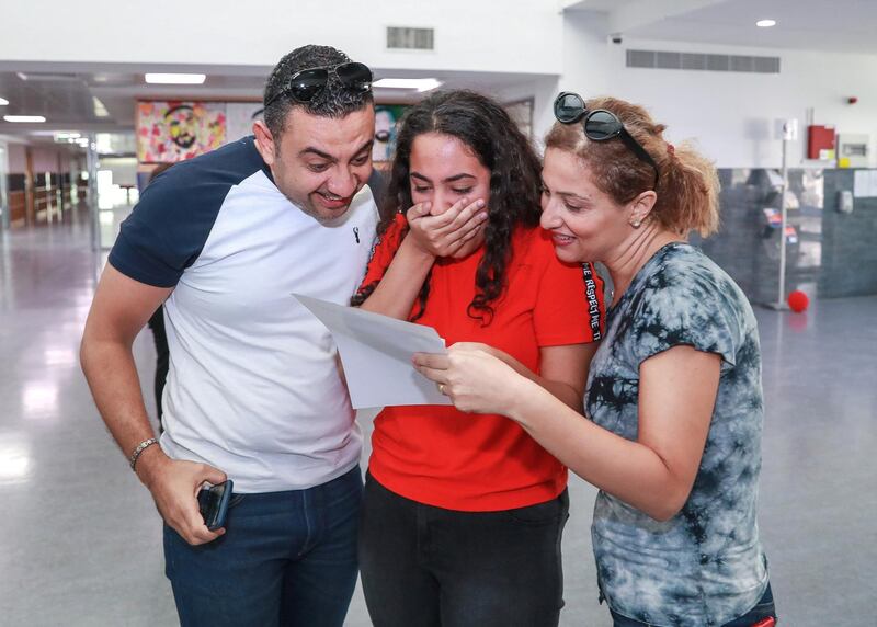 Dubai, U.A.E., August 23 , 2018.  GCSE results coverage at the Dubai British School.  (L-R) Ahmed Reda, Jannah and mother, Heba.
Victor Besa/The National
Section:  NA
Reporter:  Nick Webster
