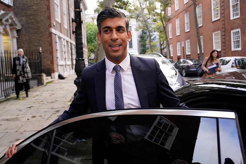 Britain's former Chancellor of the Exchequer Rishi Sunak leaves his office after announcing on Sunday that he is standing to be the next prime minister. AP