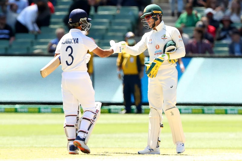 Ajinkya Rahane is congratulated by Tim Paine after India won the Melbourne Test. Getty