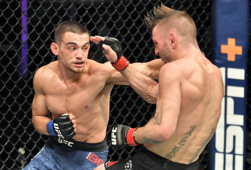 ABU DHABI, UNITED ARAB EMIRATES - JULY 16: (L-R) Ryan Benoit punches Tim Elliott in their flyweight fight during the UFC Fight Night event inside Flash Forum on UFC Fight Island on July 16, 2020 in Yas Island, Abu Dhabi, United Arab Emirates. (Photo by Jeff Bottari/Zuffa LLC via Getty Images)