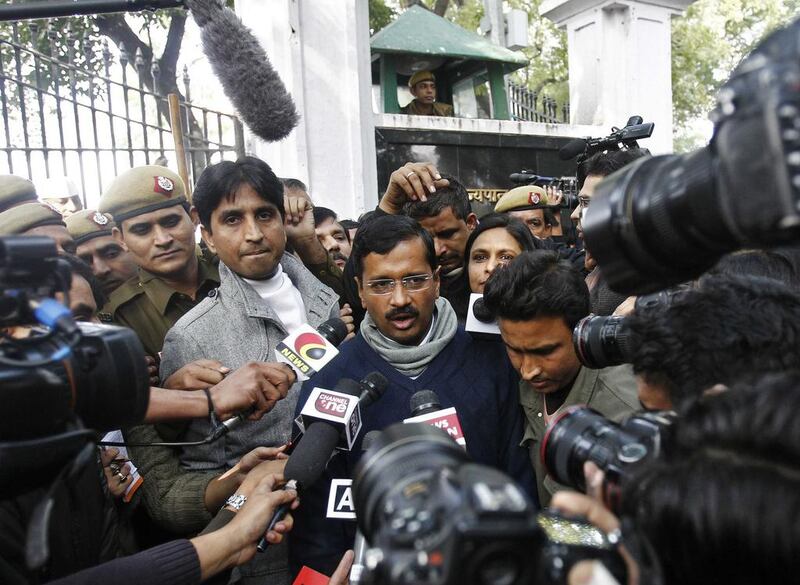 Arvind Kejriwal (centre), leader of the newly formed Aam Aadmi (Common Man’s) party, after meeting with Delhi's lieutenant governor Najeeb Jung and striking a deal to become Delhi’s chief minister.  Anindito Mukherjee / Reuters



