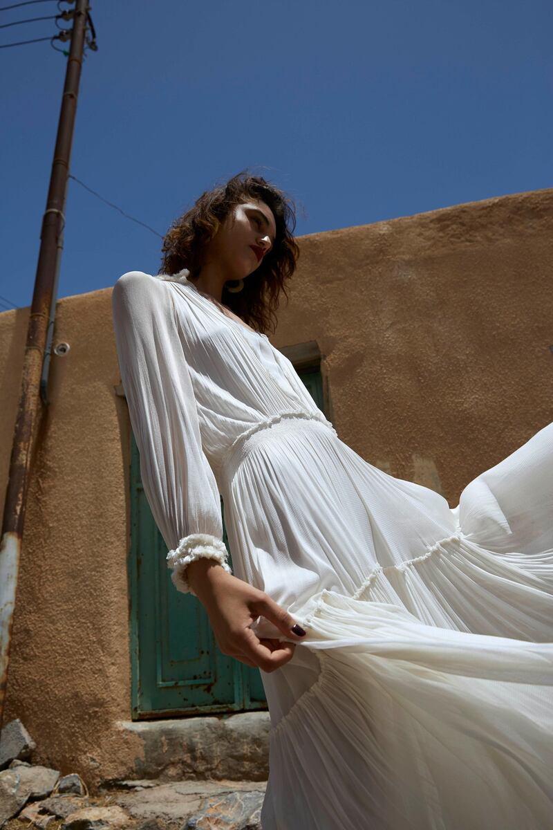 PASSAGE TO OMAN. Photography by Alex Trommlitz; Fashion director | Sarah Maisey

Ghost town (opposite page)
Dress, Dh6,783, Amanda Wakeley. Earrings, Dh323, 
Cult Gaia at ShopBop
