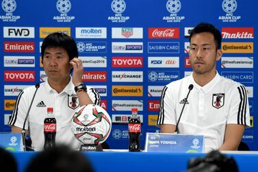 Japan manager Hajime Moriyasu, left, and captain Maya Yoshida attend the pre-match press conference ahead of the Asian Cup final. AFP