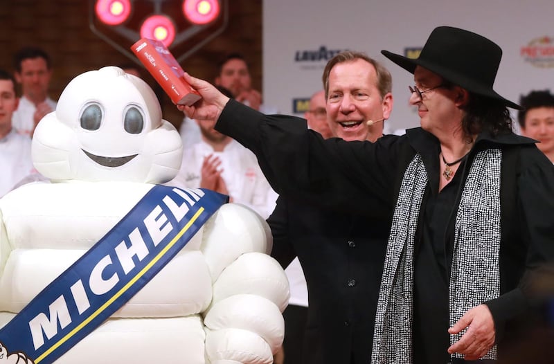 (FILES) In this file photo taken on February 5, 2018 French chef Marc Veyrat, celebrates after being awarded the maximum three Michelin stars, during the Michelin guide award ceremony at La Seine Musicale in Boulogne-Billancourt near Paris. Veyrat filed a claim against Michelin after losing his three Michelin stars award, AFP reports on September 23, 2019.  / AFP / JACQUES DEMARTHON
