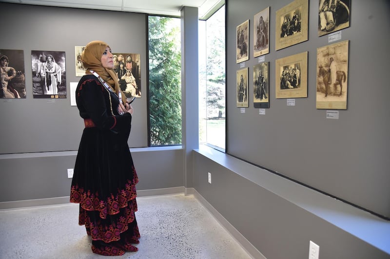 A woman looks at works on display at the Palestinian Museum in Woodbridge, Connecticut.  Hector Retamal / AFP