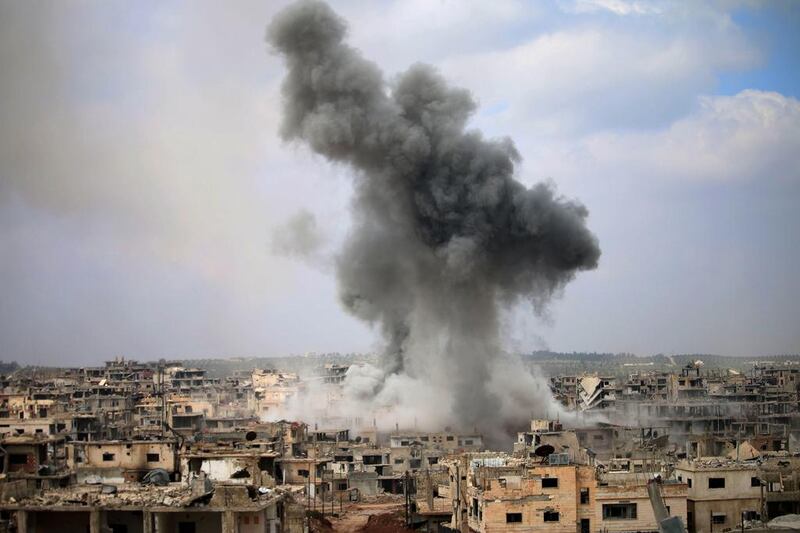 Smoke billows following a reported air strike on a rebel-held area in the southern Syrian city of Daraa. Mohamad Abazeed / AFP