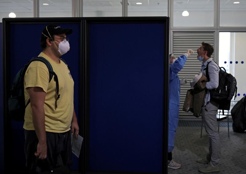 A passenger from the first Lufthansa flight to Greece, following a nationwide lockdown against the spread of the coronavirus disease (COVID-19), is tested for coronavirus, upon their arrival at the Eleftherios Venizelos International Airport in Athens, Greece. REUTERS