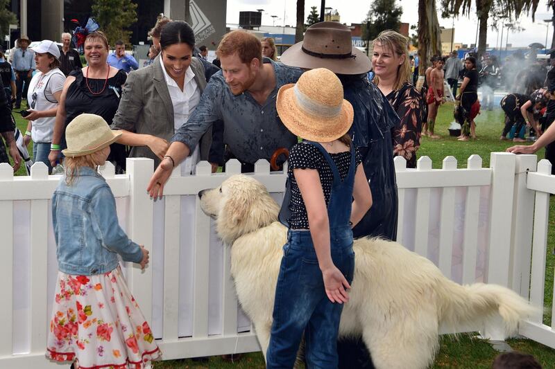 Prince Harry and Meghan meet children from a local community at Victoria Park in Dubbo on October 17, 2018.  AFP