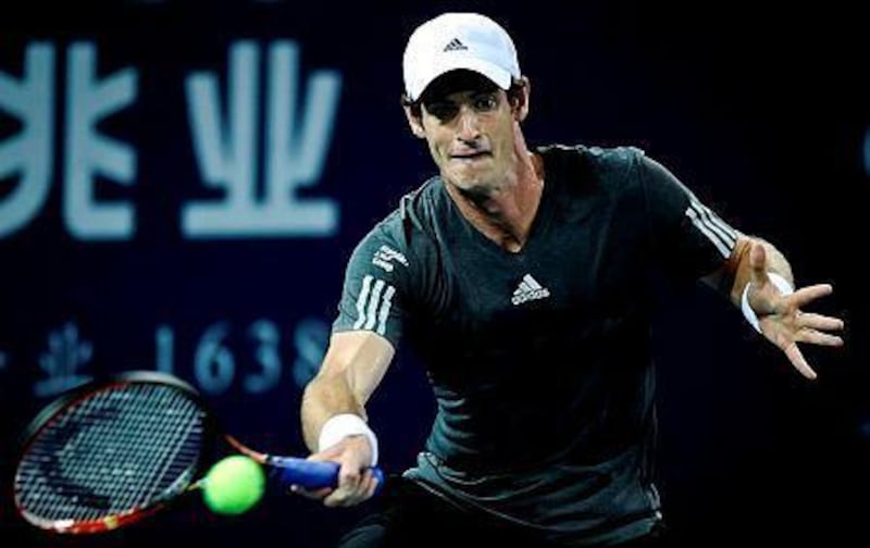 Andy Murray of Britain returns a shot against Lukas Lacko of Slovakia during their quarterfinal match at the Shenzhen Open tennis championship in Shenzhen, southern China's Guangdong province on September 26, 2014. Andy Murray beat Lukas Lacko 6-3 7-5. AFP PHOTO
