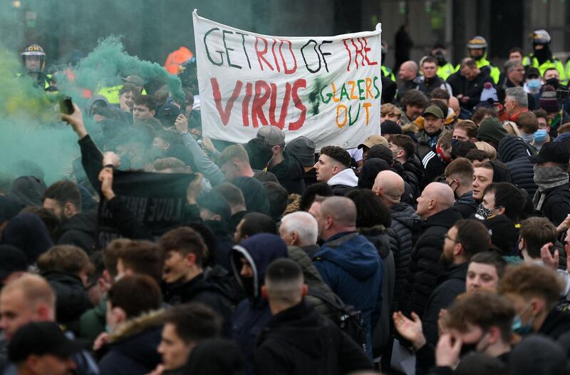 Fans protest against United's owners outside Old Trafford. AFP