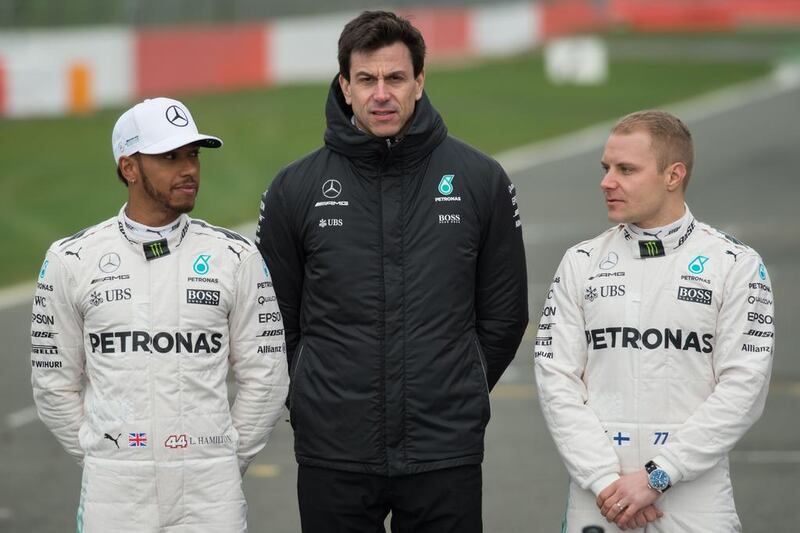 Mercedes-GP team boss Toto Wolff, centre, says they will continue to treat four-time Formula One champion Lewis Hamilton, left, and newly arrived Valtteri Bottas as equals and will not give one or the other preferential treatment, even if it is apparent Ferrari are doing just that with Sebastian Vettel. Oli Scarff / AFP