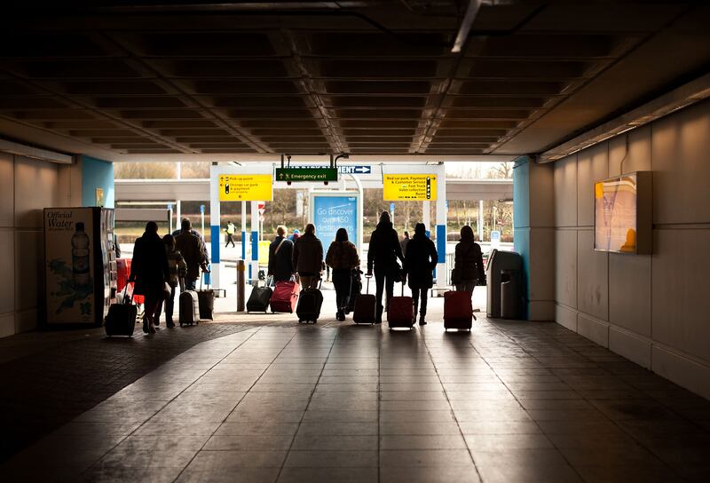 Travellers pass through Stansted Airport. Getty Images