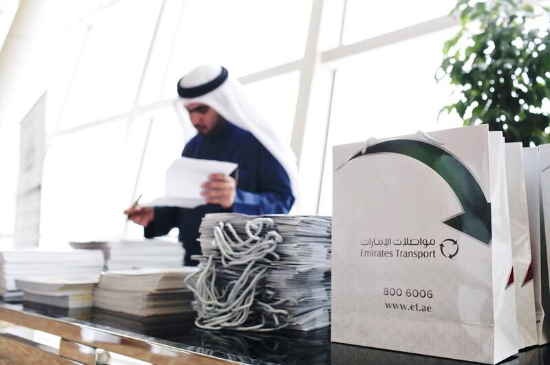 Emirati students who were surveyed said they were more motivated by a culture of respect at the workplace than material rewards. Above, an Emirati fills out applications for employment at a jobs fair in Dubai. Sarah Dea / The National