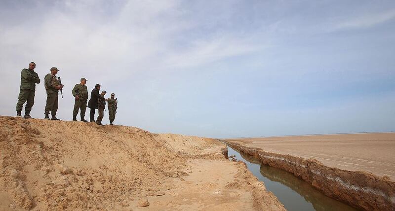 The construction of berms and water-filled trenches, according to Tunisia’s defence minister Farhat Horchani, marks an important day in country’s fight against terrorism, which has claimed dozens of lives last year. Zoubeir Souissi / Reuters